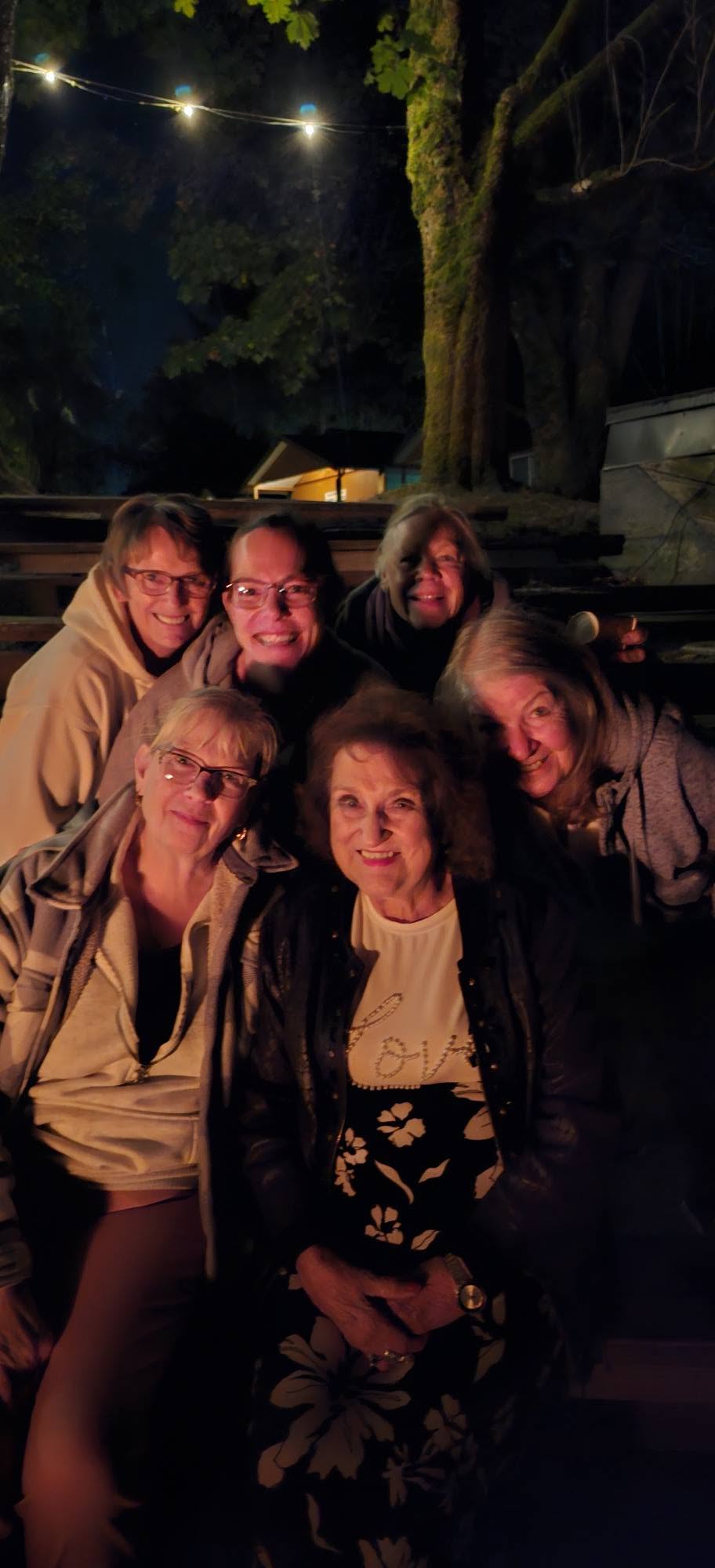 Valley Echoes members at a campfire during the chorus retreat
