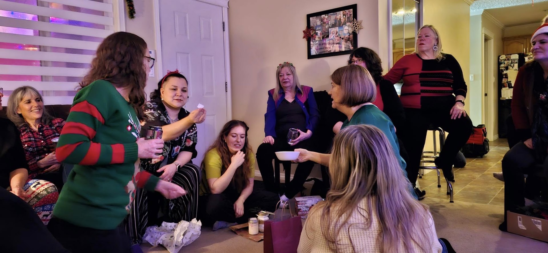 Valley Echoes members sharing snacks and laughs at a holiday gathering